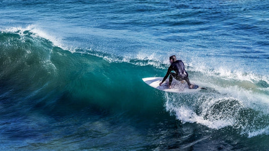 A surfer on top of a wave