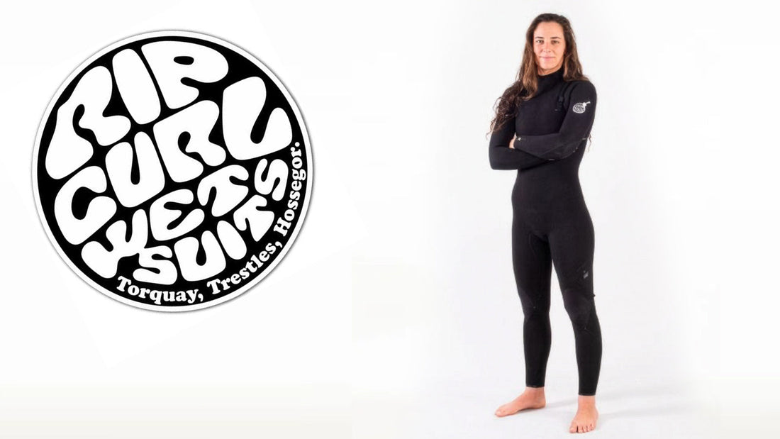 A female surfer wearing the Rip Curl E-Bomb E7 4:3 mid-season wetsuit