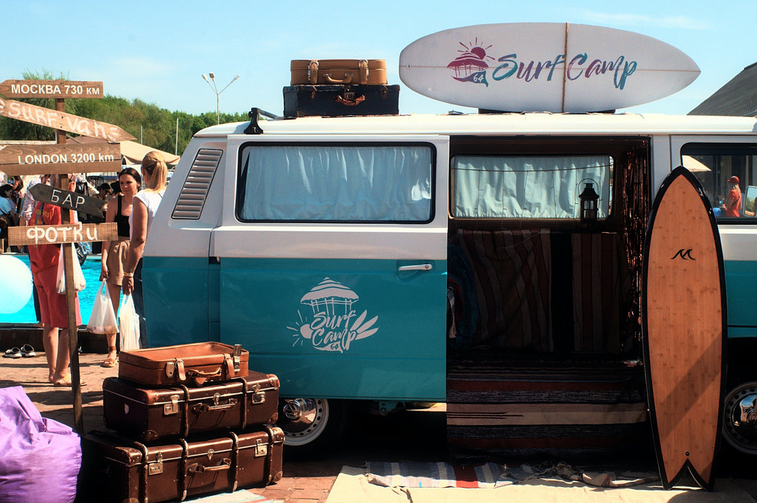 A campervan and some suitcases at a surf camp