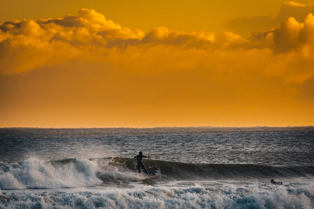 A surfer surfing in the UK