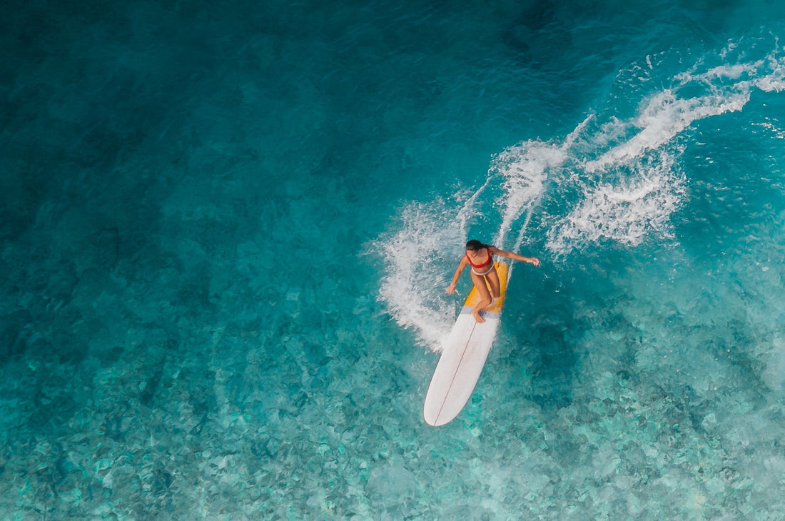 A girl surfing in a bikini