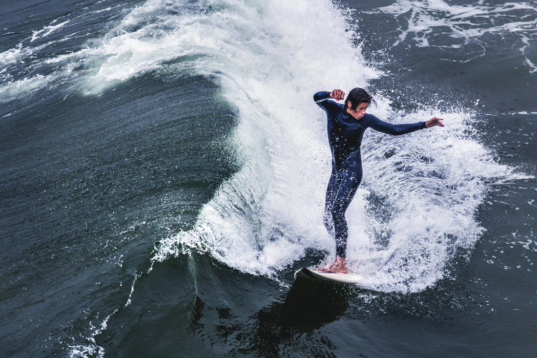 A guy surfing a wave