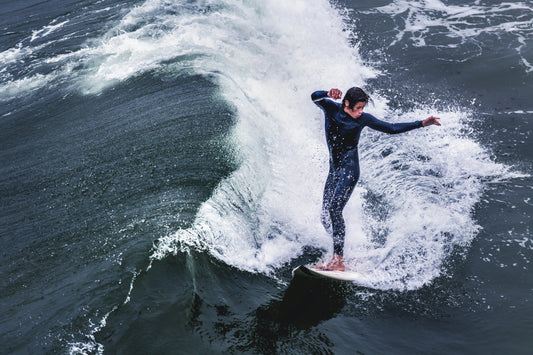 A guy surfing a wave