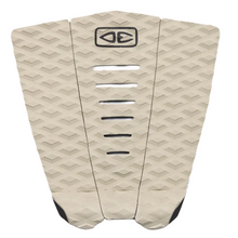 Beige surfboard tail pad with geometric pattern on a white background