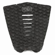 A surfboard tail paid in black with a geometric pattern on a white background.