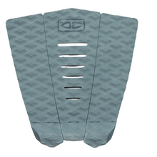Shortboard traction pad with geometric patterns in blue on a white background.