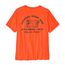 Back side of mens orange tee with a black logo on a white background